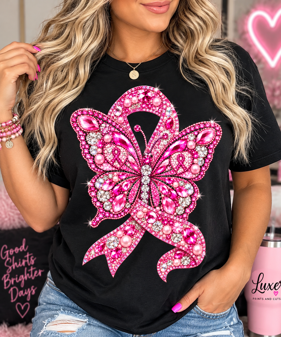 Woman wearing pink butterfly awareness design on black shirt