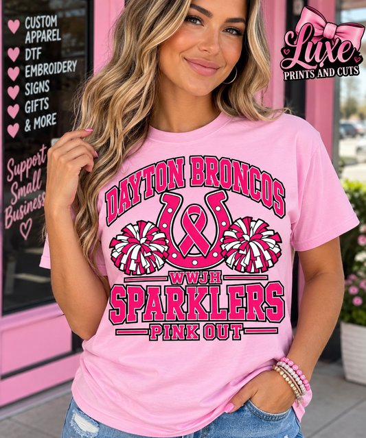 Woman in light pink Dayton Broncos WWJH Sparklers horseshoe shirt