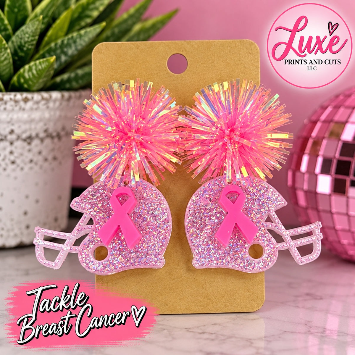 Pink pom-pom glitter football helmet earrings with breast cancer awareness ribbons